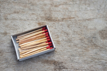Box of matches wooden sticks with red sulfur. Concept, tool or equipment used for igniting fire made from small wooden sticks. with flammable substance on one end.                           