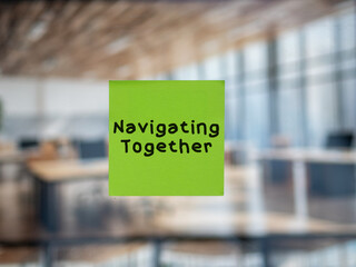 Post note on glass with 'Navigating Together'.