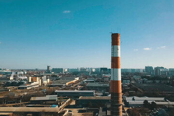 Large chimney of plant. Factory chimney and heat pipe.