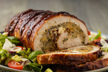 Stuffed turkey breast. Roasted whole, served with fresh vegetables.