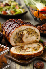 Stuffed turkey breast. Roasted whole, served with fresh vegetables.