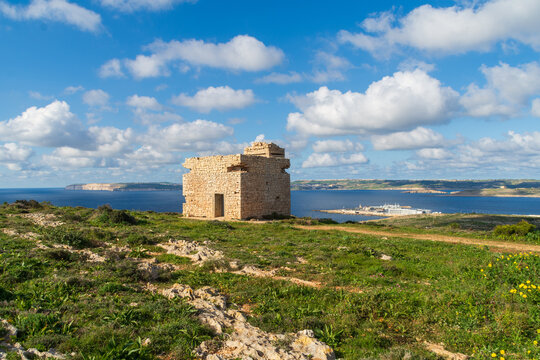Marfa Ridge, Mellieha, Malta - January 8th 2023: World War 2 era British army Pillbox on Marfa Ridge overlooking the Gozo Channel, Cirkewwa  ferry terminal and Gozo and Comino Islands.