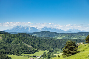 Beautiful panorama of the Pass over Tokarnia. Slovakia. View of the Tatra Mountains. - 764771216