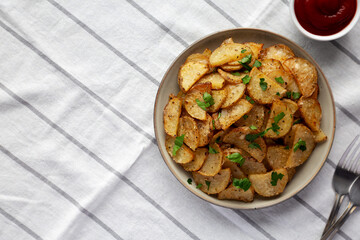 Homemade Roasted Garlic Parmesan Potatoes on a Plate, top view.