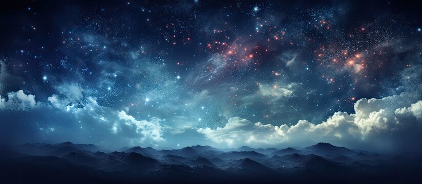 An image depicting a dark night sky filled with sparkling stars and fluffy clouds hanging over majestic mountains