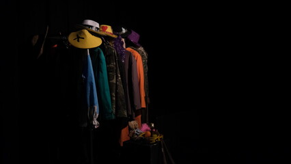 theatre costumes on hangers. stage costumes under the spotlight.