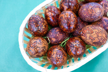High angle view of easter eggs in plate on table