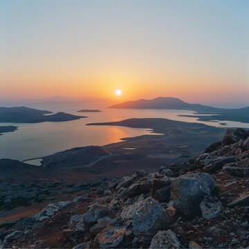 the sunrise over the Aegan Sea from the vantage point of the tallest peak on the island of Paros