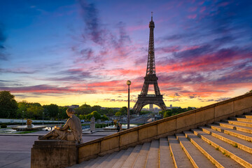 Sunrise view of Eiffel Tower from Jardins du Trocadero in Paris, France. Eiffel Tower is one of the most iconic landmarks of Paris - 764832024
