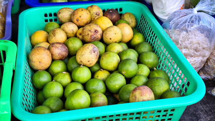Squeezed orange or Citrus sinensis are sold and displayed in traditional markets.