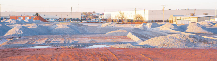 Panorama large pile of crushed gravel heap at construction site warehouse district North of...