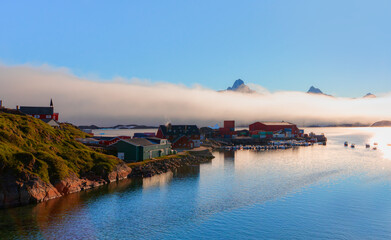 Picturesque village on coast of Greenland - Colorful houses in Tasiilaq, East Greenland