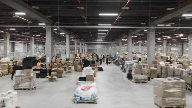 Marketplace warehouse where people sort goods for shipment.