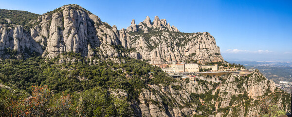 Panoramic view of the monastery of montserrat in catalonia spain against a beautiful rocky mountain