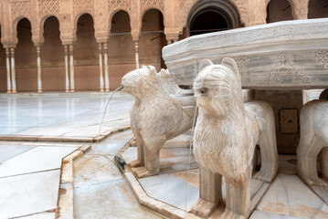GRANADA, SPAIN - AUG 25: Court of Lions in the main courtyard of the Nasrid dynasty Palace in the Alhambra, the Moorish citadel in Granada and a UNESCO World Heritage Site.