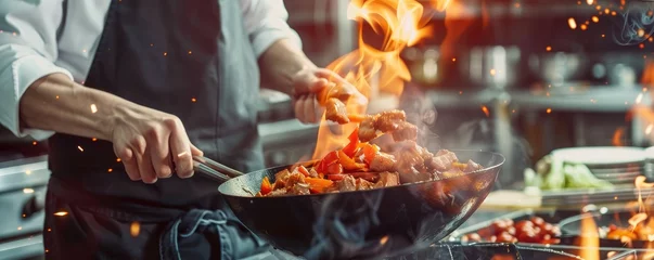 Foto op Aluminium chef's hands as they expertly toss a vegetable stir-fry in a pan amid towering flames in a kitchen © Filip