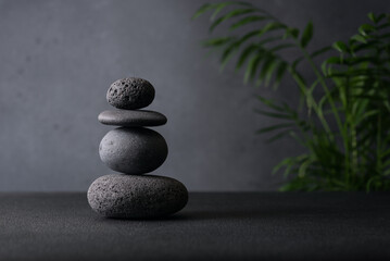 Serene stack of smooth grey stones balanced in a zen-like arrangement