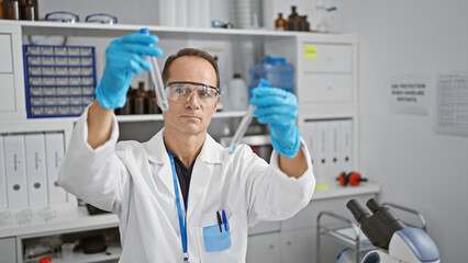 Hispanic middle age man, a serious scientist engrossed in his experiment, securely handles test tubes in his lab, carefully measuring liquid samples for medical research with intense concentration.
