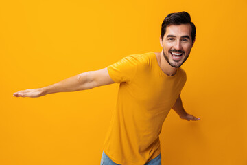 Man yellow space portrait smiling gesture background arm studio style laughing trendy copy...