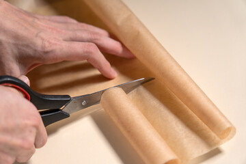 Cutting with scissors parchment paper. Making Salted Caramel Chocolate Cold Cake Series.