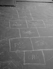 Hopscotch is an outdoor game played by children in the school yard.