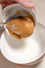 Add caramel to thickened cream. Cooking Salted Caramel Chocolate Cold Cake Series.