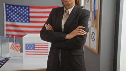 A confident african american woman with crossed arms stands in an electoral college room, embodying...