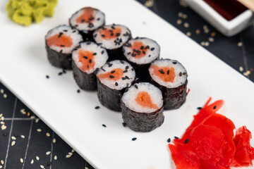 Maki sushi over black background