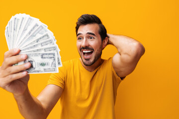 Dollar man yellow currency happy rich money business hand cash background surprised finance smiling