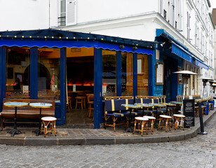 Cozy street with tables of cafe in quarter Montmartre in Paris, France. Architecture and landmarks...