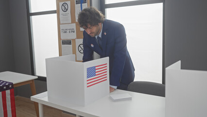 Hispanic man voting in american election, indoor with us flags