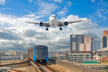 View railway track suburban subway electric train rushing to . Passenger plane flying in clouds...
