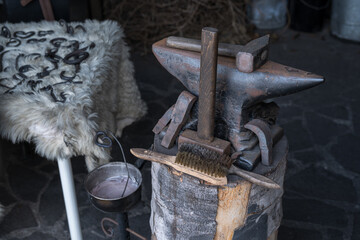 Anvil with hammers in a forge.
