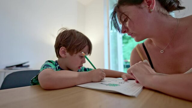 Childhood Literacy - Mother Instructs Son On Writing His First Letters, Homeschooling
