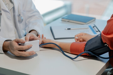 Doctors are giving blood pressure measuring devices to check people's pulses and blood pressures to...