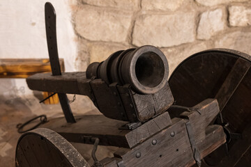 A small metal portable cannon.