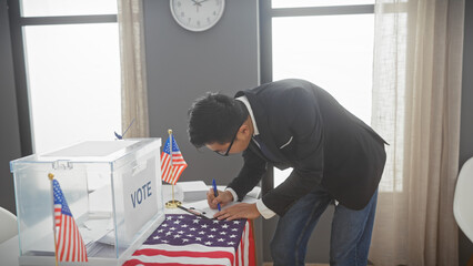 Asian man in a suit voting at a us election center with american flags