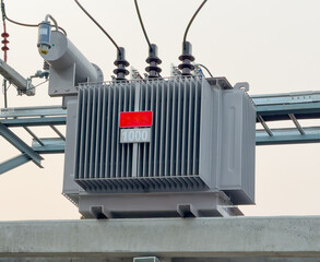 Electrical transformer on top of a concrete pole