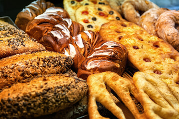 Fresh various pastries in bakery showcase. Sale of baked goods in the store.