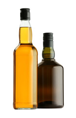 Different sorts of whiskey in glass bottles isolated on white
