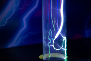 A purple and blue glowing tube with a red line running through it. The tube is lit up and he is a...