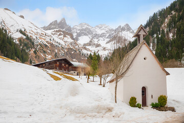 hiking destination Einodsbach, chapel and farmstead, allgau alps in winter season