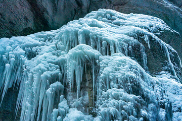 Fototapeta na wymiar A Winter walk through the Partnachklamm canyon with iceicles