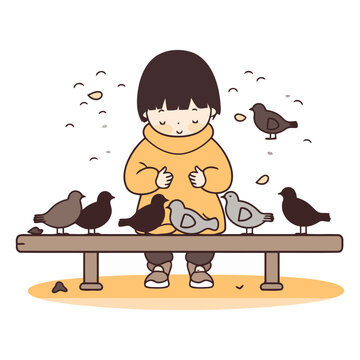 Little girl sitting on a bench and feeding pigeons.