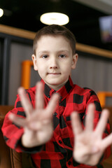 Child shows the number eight fingers