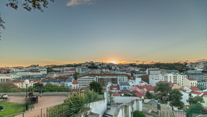 Panorama showing Jardim do Torel timelapse with views to the city center of Lisbon during sunset. Portugal