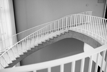 Spiral Staircase in Building With White Railings