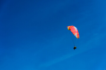 Paragliding extreme Sport with blue Sky and clouds in the background, Combining a Healthy Lifestyle...