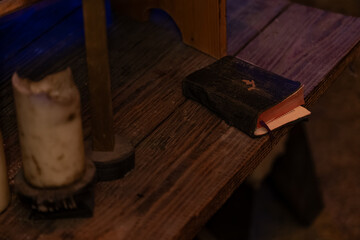 Old book lying on the table. - obrazy, fototapety, plakaty