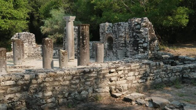 Ruins of Great Basilica in Butrint National Park, Buthrotum, Albania. Triconch Palace at Butrint Life and death of an ancient Roman house Historical medieval Venetian Tower surrounded. Butrint